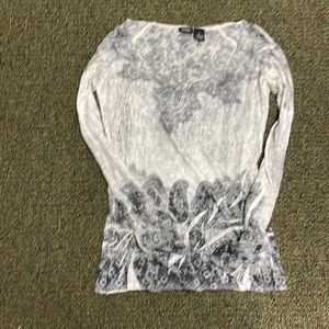 Small woman top. Long sleeve.  Has some bling on it too!